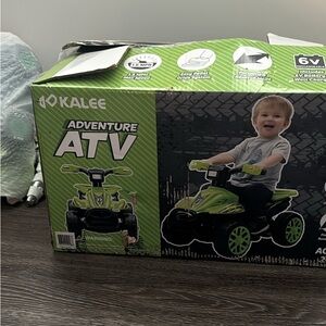 Kids ATV power wheel. never used boxes only open because my son.
